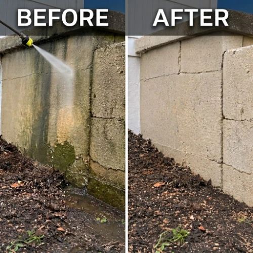 Before and after cleaning of a stained concrete block wall in Baytown, showing green algae and water stains removed with a pressure spray